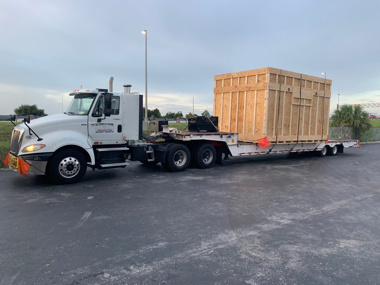 contact us 3 custom crating manufacturer | truck carrying large custom crate